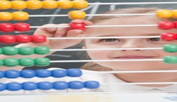 Primary school pupil using an abacus